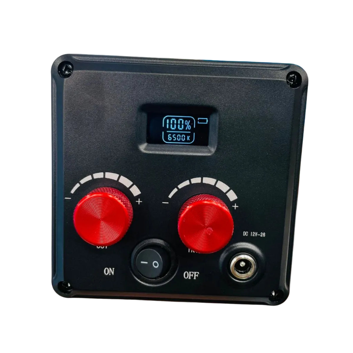 Black electronic control panel with red buttons held in a hand against a blurred background